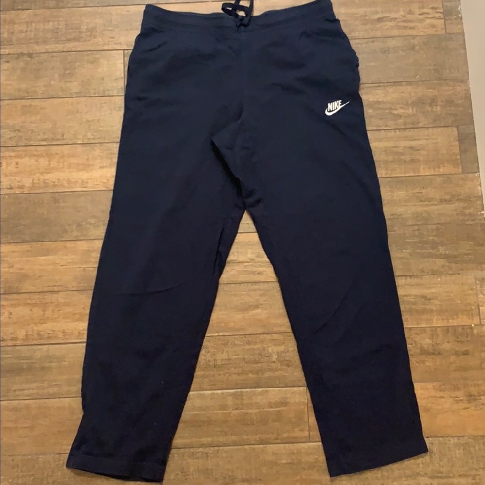 Nike track pants.